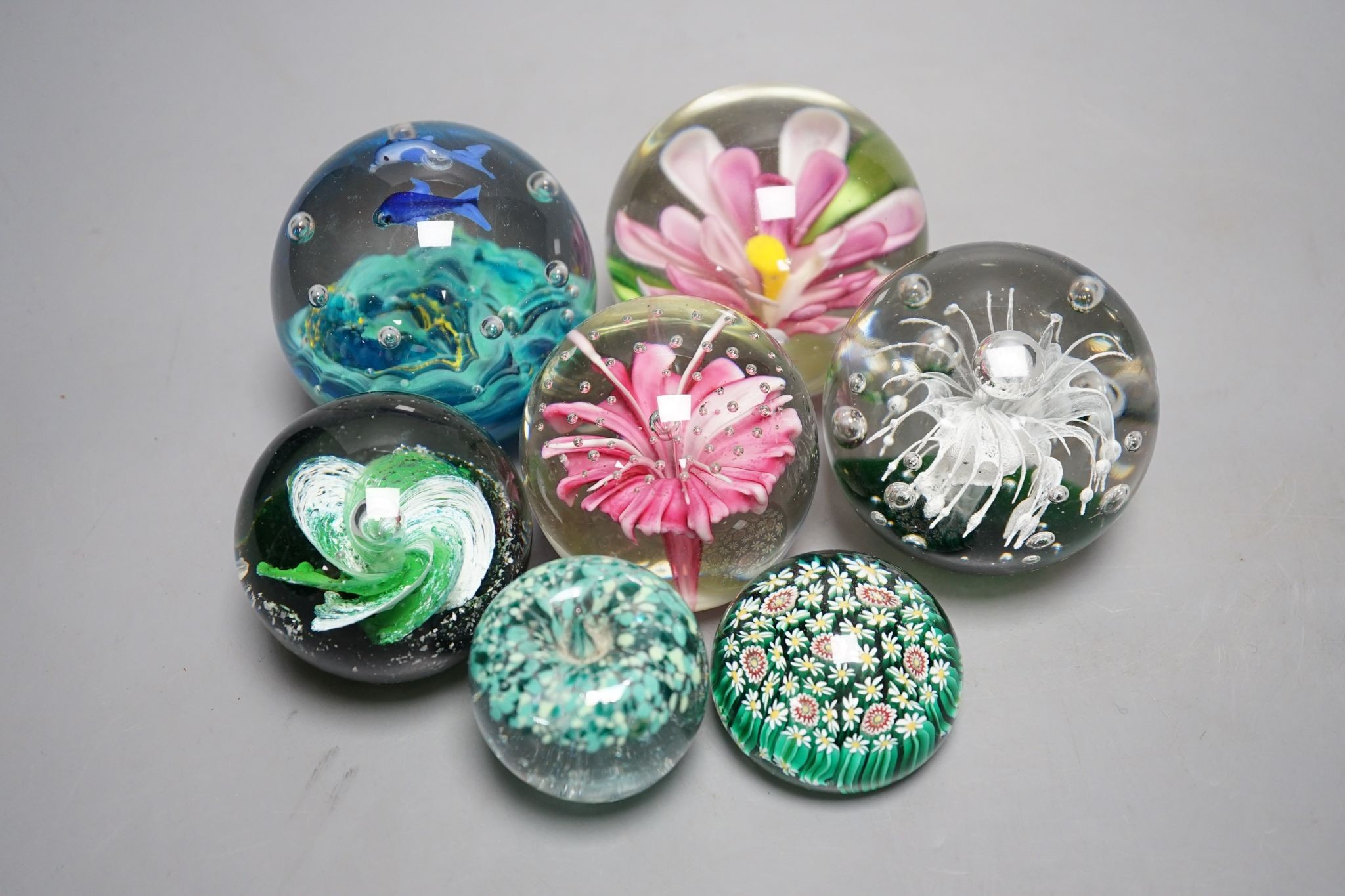 A group of glass paperweights including Caithness